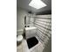 Bathroom featuring a toilet, vanity with sink, and tiled floors at 1511 Hobson St, Longwood, FL 32750