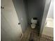 Cozy bathroom featuring tile floors, a toilet, and a bathtub at 1511 Hobson St, Longwood, FL 32750