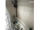 Bathroom with a white tiled shower and bathtub, featuring a shower head, faucet, and shower curtain at 1511 Hobson St, Longwood, FL 32750