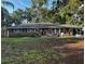 Low-angle view of the home's exterior showcasing the facade with brick and siding under a roof at 1511 Hobson St, Longwood, FL 32750