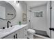 Bright bathroom featuring a modern vanity, lighting and a subway tile shower at 1533 Fort Smith Blvd, Deltona, FL 32725