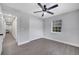This bedroom features wood floors, a ceiling fan, and a closet at 1533 Fort Smith Blvd, Deltona, FL 32725