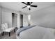 Bedroom with closet, ceiling fan, chair, and interior view to bathroom at 1533 Fort Smith Blvd, Deltona, FL 32725