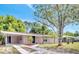 Charming single-story home featuring a neatly landscaped front yard and cozy covered entryway at 1533 Fort Smith Blvd, Deltona, FL 32725