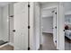 Hallway view showing access to the updated bathroom and the main bedroom at 1533 Fort Smith Blvd, Deltona, FL 32725