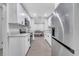 Clean kitchen featuring white cabinets, stainless steel appliances, and a view into the adjacent dining area at 1533 Fort Smith Blvd, Deltona, FL 32725