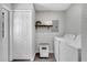 Functional laundry area with a full-size washer and dryer and plenty of storage options at 1533 Fort Smith Blvd, Deltona, FL 32725