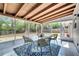 Inviting screened sunroom features tiled floors and backyard views, creating a perfect spot for relaxation and enjoying outdoor living at 1533 Fort Smith Blvd, Deltona, FL 32725