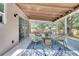 Relax in the sunroom with stylish chairs and a beautiful backyard view at 1533 Fort Smith Blvd, Deltona, FL 32725