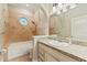 Cozy bathroom with a tub-shower combination and vanity with granite countertop at 1542 Islay Ct, Apopka, FL 32712