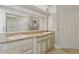 Bathroom featuring double sinks with granite countertop and vanity with drawers and cabinets at 1542 Islay Ct, Apopka, FL 32712