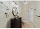 Bathroom featuring a vanity, decorative mirror, and travertine floors, complete with adjacent toilet at 1542 Islay Ct, Apopka, FL 32712