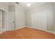 Neutral bedroom featuring a double closet and door to the en suite bathroom at 1542 Islay Ct, Apopka, FL 32712