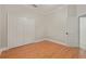 Neutral bedroom with wood flooring and a double closet at 1542 Islay Ct, Apopka, FL 32712