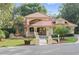 Charming two-story home featuring a red tile roof, meticulously landscaped yard, and inviting fountain feature at 1542 Islay Ct, Apopka, FL 32712