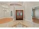 Grand foyer showcasing soaring ceilings, a stylish chandelier, and exquisite tile flooring design at 1542 Islay Ct, Apopka, FL 32712