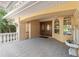 Covered front entrance featuring double wooden doors and a decorative water feature at 1542 Islay Ct, Apopka, FL 32712