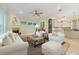 Bright and airy living room with comfortable seating, fireplace, and stylish décor elements at 1542 Islay Ct, Apopka, FL 32712