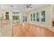 Bright living room featuring a fireplace, multiple windows, and seamless access to the kitchen at 1542 Islay Ct, Apopka, FL 32712