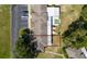 Aerial view showcasing condo complex, parking, and outlined property lines at 1543 Club Cir, Lakeshore, FL 33854
