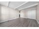 Bedroom featuring light gray flooring, a closet, and white exposed ceiling beams at 1543 Club Cir, Lakeshore, FL 33854