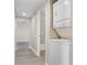 Hallway with a washer and dryer hook-up, leading to the bathroom and other rooms at 1543 Club Cir, Lakeshore, FL 33854
