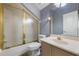 Bathroom featuring a shower with gold frame, a vanity, and a toilet at 1874 Royal Majesty Ct, Oviedo, FL 32765
