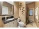 Bathroom featuring a vanity with a black countertop, toilet, shower, and outdoor access at 1874 Royal Majesty Ct, Oviedo, FL 32765