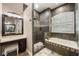 Full bathroom featuring a large, tiled shower and soaking tub beneath a shuttered window at 1874 Royal Majesty Ct, Oviedo, FL 32765