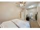 Bright bedroom featuring a ceiling fan and a well-lit desk area with outside access at 1874 Royal Majesty Ct, Oviedo, FL 32765