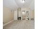 Large bedroom area with carpet and an adjoining bathroom, offering convenient access at 1874 Royal Majesty Ct, Oviedo, FL 32765
