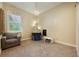 Bright bedroom featuring an armchair, play tent, and a window with sheer curtains at 1874 Royal Majesty Ct, Oviedo, FL 32765