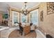 Charming dining nook with a chandelier and views of the outdoors at 1874 Royal Majesty Ct, Oviedo, FL 32765