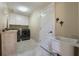 The laundry room features washer, dryer, utility sink, overhead cabinets, and neutral paint at 1874 Royal Majesty Ct, Oviedo, FL 32765