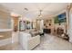 Open-concept living area with stone fireplace, light, and comfortable seating at 1874 Royal Majesty Ct, Oviedo, FL 32765