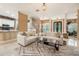 Spacious living area showcases neutral tones, tile flooring, and seamless flow to the kitchen at 1874 Royal Majesty Ct, Oviedo, FL 32765