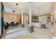 Open living space with stone pillars, fireplace, and access to outdoor living at 1874 Royal Majesty Ct, Oviedo, FL 32765