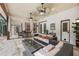 Covered patio featuring comfortable seating and a dining area at 1874 Royal Majesty Ct, Oviedo, FL 32765