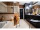 Spa-like bathroom with a glass-enclosed shower, soaking tub, and elegant finishes at 2237 Osprey Woods Cir, Orlando, FL 32820