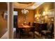 Formal dining room with decorative lighting, elegant furniture, and sophisticated decor at 2237 Osprey Woods Cir, Orlando, FL 32820