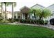 Charming single-story home with stone accents, lush landscaping, and a well-manicured lawn at 2237 Osprey Woods Cir, Orlando, FL 32820
