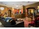 Spacious living room featuring hardwood floors, stylish furnishings, and an open connection to the kitchen at 2237 Osprey Woods Cir, Orlando, FL 32820