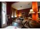Cozy living room with warm tones, comfortable seating, and lots of light from the doorway at 2237 Osprey Woods Cir, Orlando, FL 32820