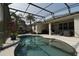 Screened-in pool and patio area, perfect for outdoor lounging and entertainment in a private backyard at 2237 Osprey Woods Cir, Orlando, FL 32820