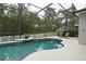 Screened-in pool area with comfortable lounge seating and a well-maintained patio at 2237 Osprey Woods Cir, Orlando, FL 32820