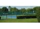 A fenced tennis court area with blue and green courts surrounded by green landscaping for active community members at 2237 Osprey Woods Cir, Orlando, FL 32820