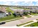 An aerial view of a home with a pond, water feature, and community at 2431 Tudor Rose Dr, Sanford, FL 32773