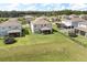 An aerial view of a backyard with grass, fencing, and playground equipment at 2431 Tudor Rose Dr, Sanford, FL 32773