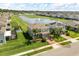 An aerial view of a home with a pond, water feature, and community at 2431 Tudor Rose Dr, Sanford, FL 32773