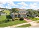 Charming two-story home with beautifully landscaped front yard and brick paved driveway at 2431 Tudor Rose Dr, Sanford, FL 32773